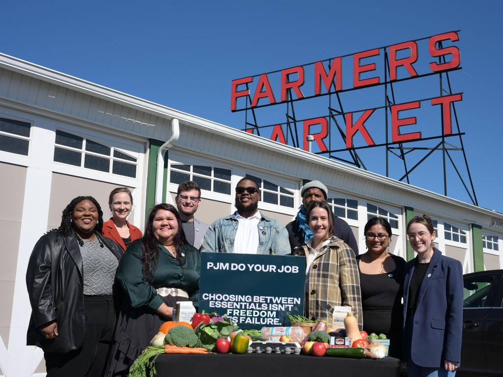 Photo of a group taking action at a public market